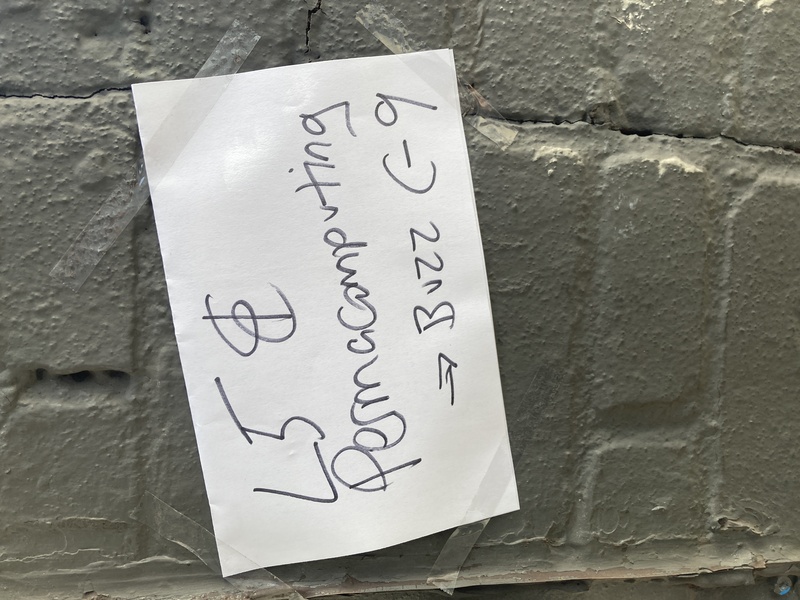 A taped-up sign that says L5 & Permacomputing - Buzz C-9