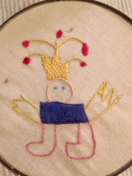 self-portrait of the author/artist in embroidery, age 6
