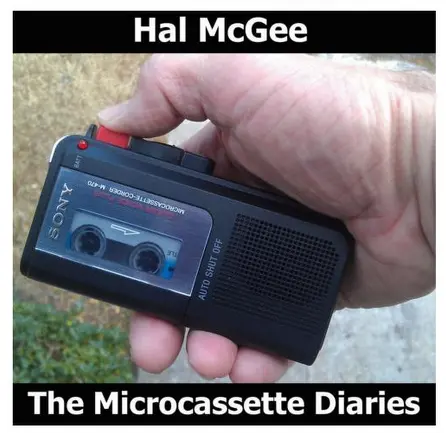 album cover for Hal McGee’s The Microcassette Diaries - a hand holding a microcassette recorder with thumb on red record button