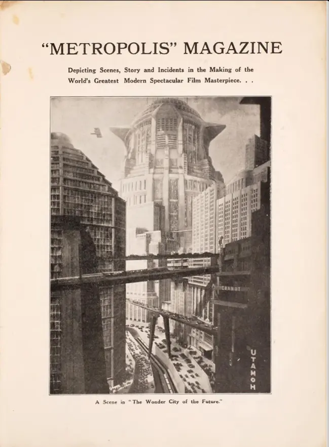 brown and offwhite cover of Metropolis Magazine, showing a vision of a futurist city with high rises and traffic and highways between buildings