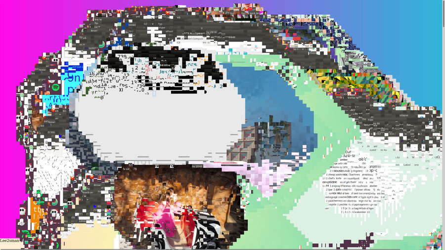 Screenshot of glitched out image showing pixelated and distorted overlapping images and text including a kids toy car ride and broken up text and email, hard to read.